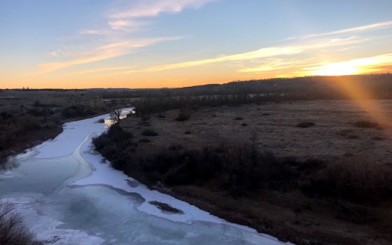 Sunrise over a frozen creek