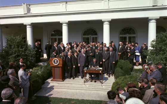 President Lyndon Johnson signs the Economic Opportunity Act, one of the War on Poverty initiatives, on Aug. 20, 1964. (Wikimedia Commons/U.S. Government)