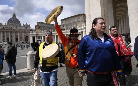Indigenous artists from across Canada walk in St. Peter's Square, at the Vatican, Friday, April 1. (AP file photo/Alessandra Tarantino)