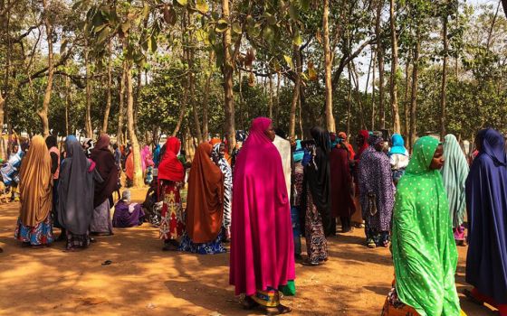 A group of women gather outside Area 1 IDP Camp for internally displaced persons in Abuja, Nigeria. (Chinedu Asadu)