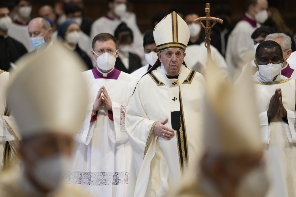 Pope Francis walks with his pastoral staff among cardinals and prelates at the end of an Epiphany Mass in St. Peter's Basilica at the Vatican, Jan. 6, 2022. (AP/Gregorio Borgia)