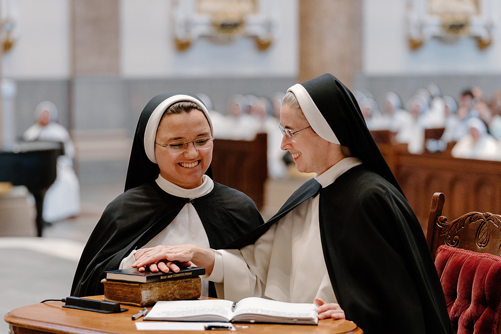 Dominican Sr. Eva Marie Gorman makes her profession of vows to Mother Anna Grace Neenan, prioress general of the Dominican Sisters of St. Cecilia Congregation, during the Mass for the Rite of Perpetual Religious Profession July 25 at the Cathedral of the Incarnation in Nashville, Tennessee. (OSV News/Tennessee Register/Rachel Lombardi)