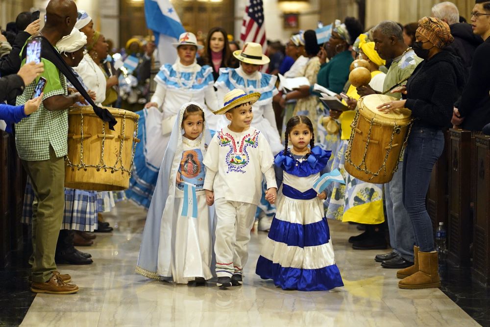 Children dressed in traditional clothing arrive in procession for a Spanish-language Mass celebrated in honor of Our Lady of Suyapa, patroness of Honduras, at St. Patrick's Cathedral in New York City Feb. 5, 2023. 