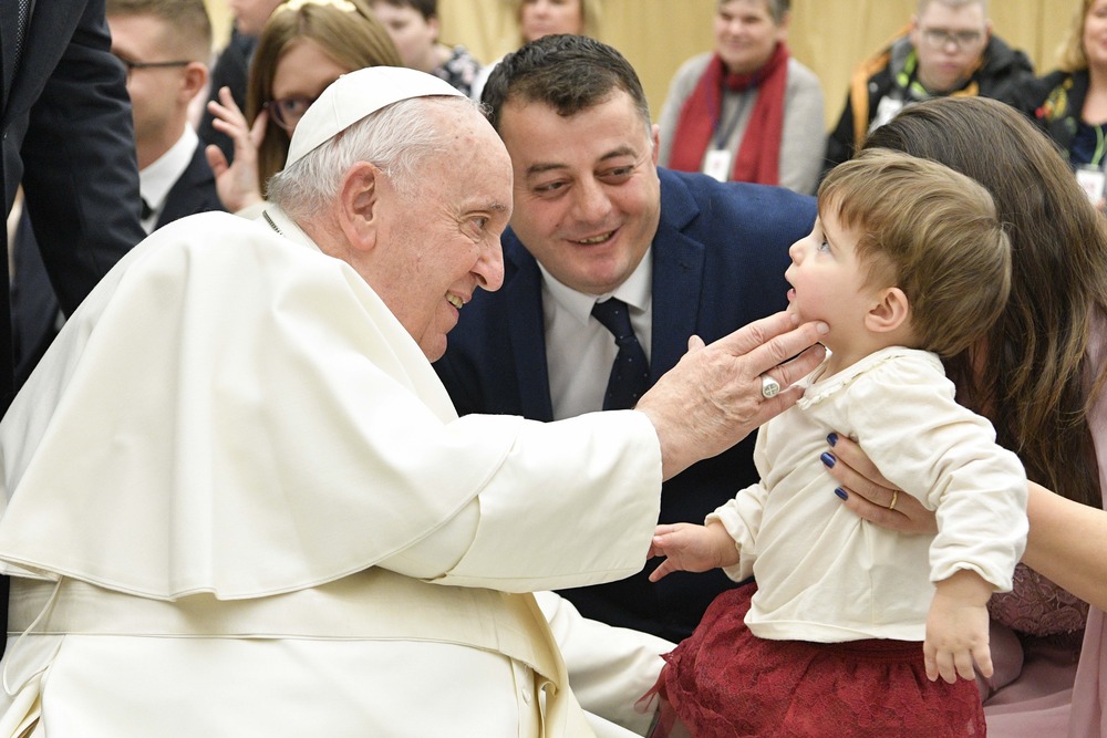 Pope Francis greets child from wheelchair