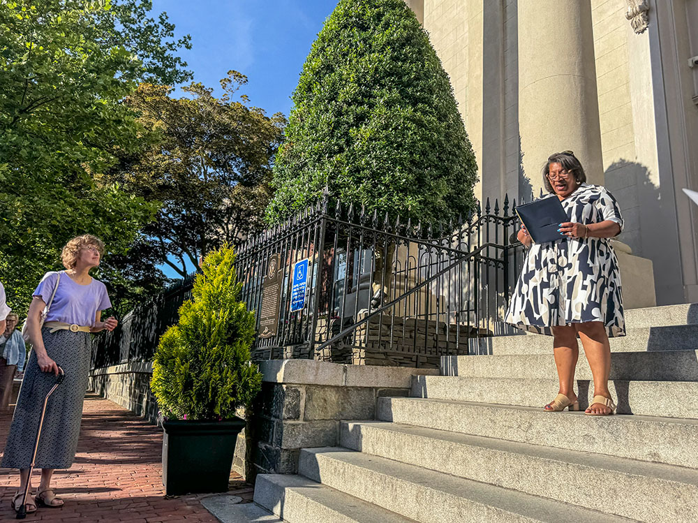 Linda Gray, whose ancestors left Washington's Holy Trinity Catholic Church in the 1920s because of the segregation they experienced there, addresses a crowd that gathered June 19 to unveil a plaque outside the church acknowledging "sins of racism" at the parish. "The truth hurts, it does, but the truth also has the power to heal," Gray said. (NCR photo/Rhina Guidos)