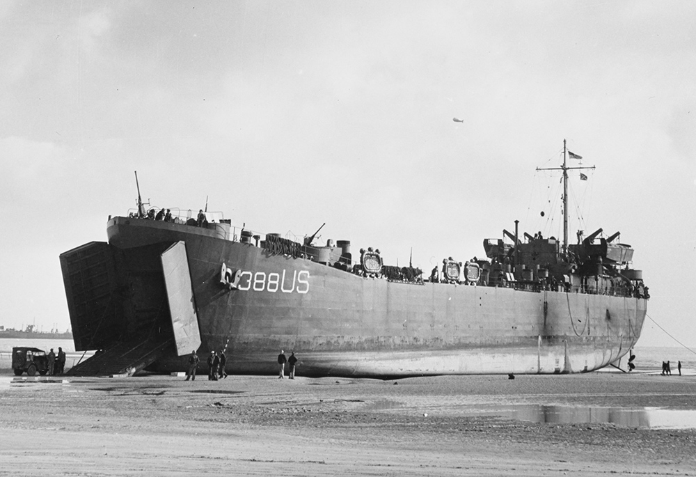 USS LST-388 unloads on a Normandy beach at low tide on June 12, 1944. (Wikimedia Commons/U.S. Navy Photograph/Combat Photo Unit Eight (CPU-8))