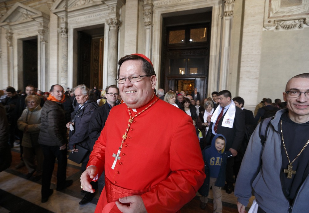 Lacroix, in scarlet, smiles outside St. Peter's. 