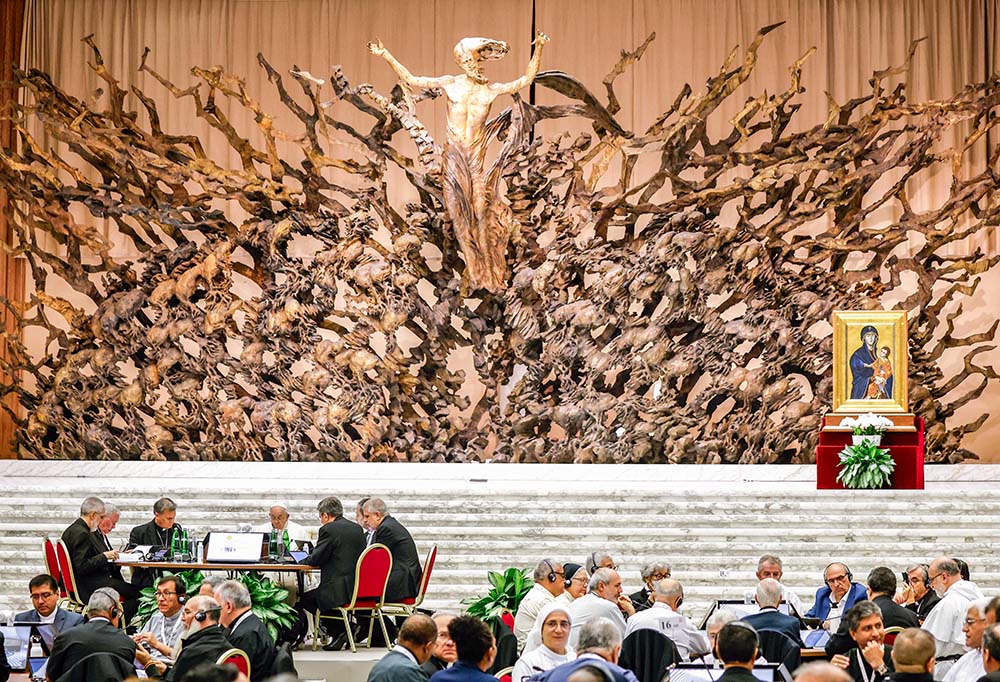 Pope Francis and members of the assembly of the Synod of Bishops gather for a working session in the Vatican's Paul VI Audience Hall Oct. 23, 2023. (CNS/Lola Gomez)