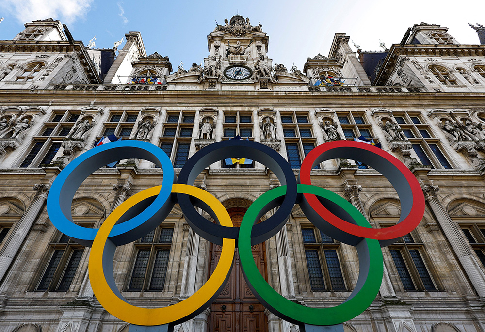 The Olympic rings are seen in front of the Hotel de Ville City Hall in Paris March 14, 2023. The Olympics will take place July 26 - Aug. 11. (OSV News/Reuters/Gonzalo Fuentes)