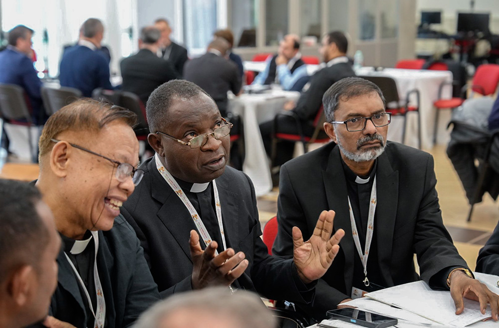 Parish priests who are part of an international gathering to provide input to the Synod of Bishops on synodality meet in small groups April 29 at a retreat center in Sacrofano, outside of Rome. (CNS/Courtesy of the Synod of Bishops)