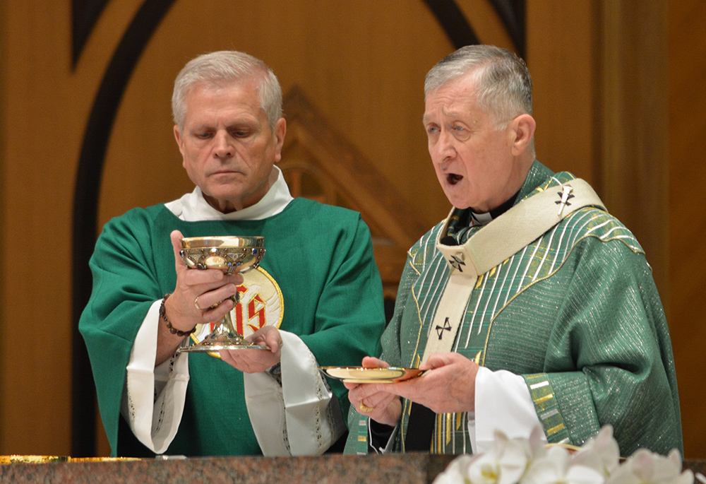 Chicago Cardinal Blase Cupich, right, celebrates Mass at Holy Name Cathedral in Chicago June 30, for the perpetual pilgrims on the Marian Route of the National Eucharistic Pilgrimage and others joining the pilgrimage as it made its way through Chicago. Cupich spoke at the National Eucharistic Congress July 18 in Indianapolis. (OSV News/Simone Orendain)