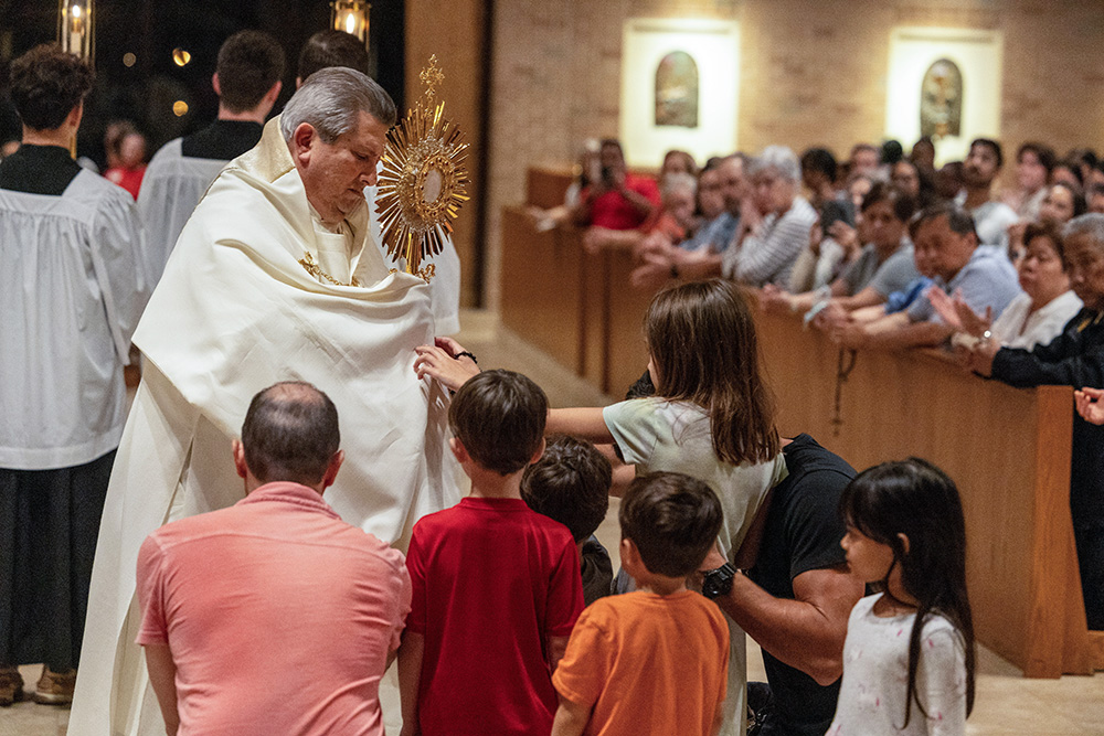 Children pray during eucharistic adoration at St. Laurence Church in Sugar Land, Texas, May 30. More than 1,200 faithful gathered at the church, one of several stops in the Galveston-Houston Archdiocese along the St. Juan Diego Route of the National Eucharistic Pilgrimage. (OSV News/Texas Catholic Herald/James Ramos)