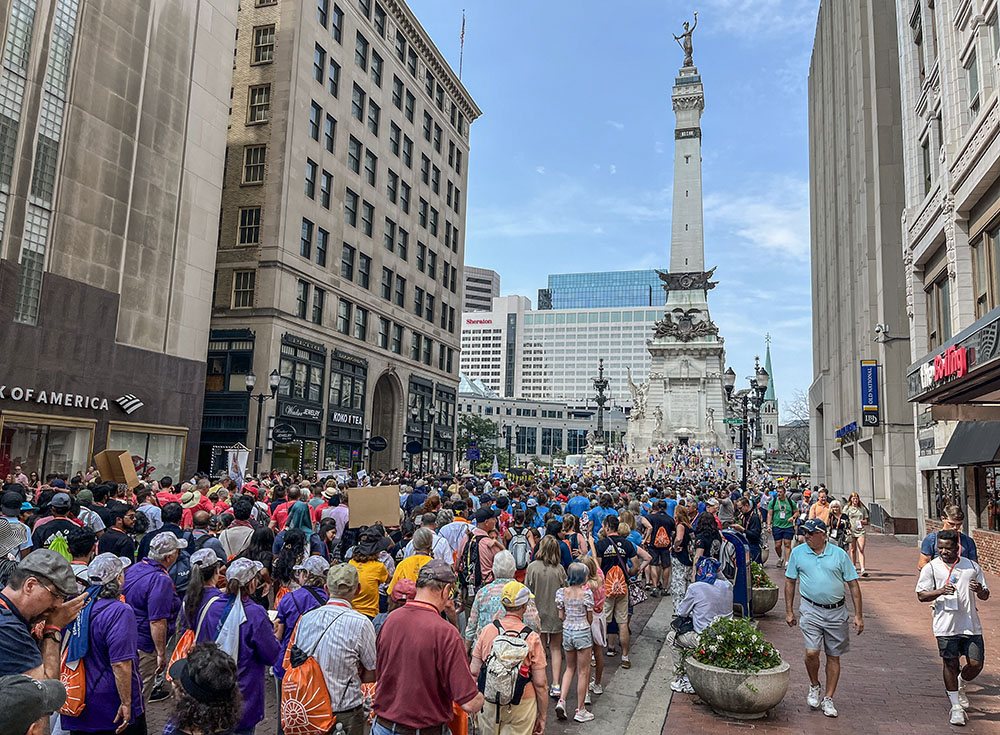 Thousands walk down Meridian Street past the Soldiers and Sailors Monument in Indianapolis July 20 for a Eucharistic procession in conjunction with the National Eucharistic Congress. (OSV News/Peter Jesserer Smith)