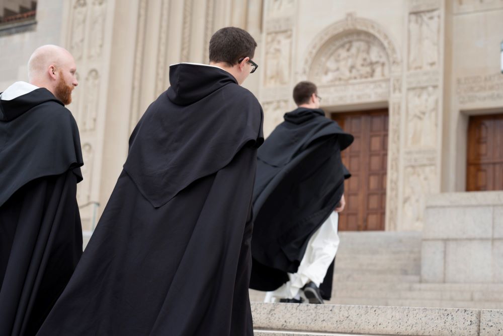 Dominican friars prepare to greet pilgrims during the Dominican Rosary Pilgrimage at the Basilica of the National Shrine of the Immaculate Conception in Washington Sept. 30, 2023.