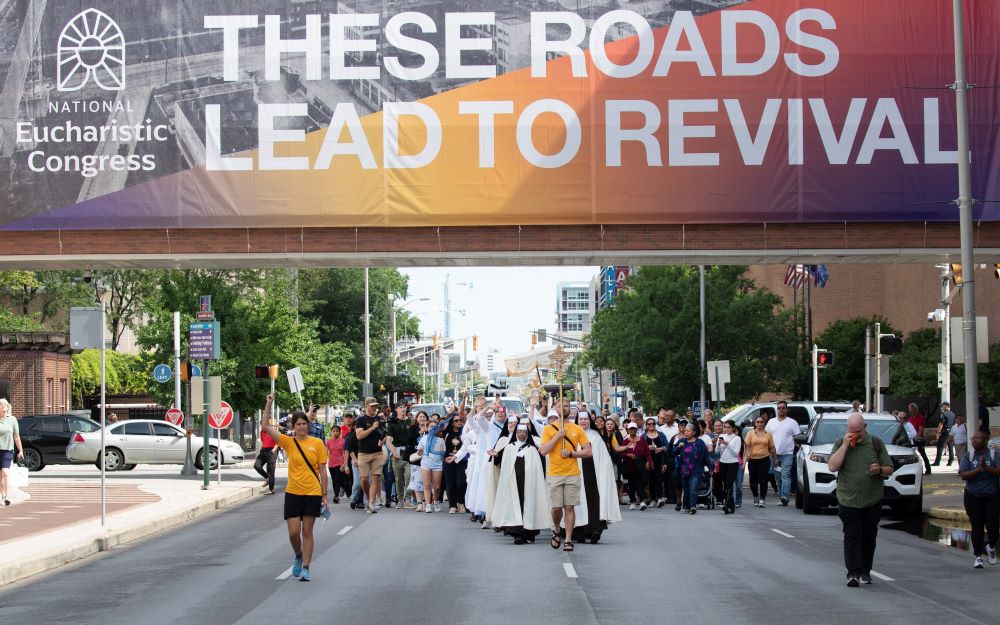 Pilgrims on the final leg of the National Eucharistic Pilgrimage's Seton Route, which launched May 18 in New Haven, Conn., arrive for a welcome Mass at St. John the Evangelist Church in Indianapolis July 16, ahead of the National Eucharistic Congress. (OSV News/Bob Roller)
