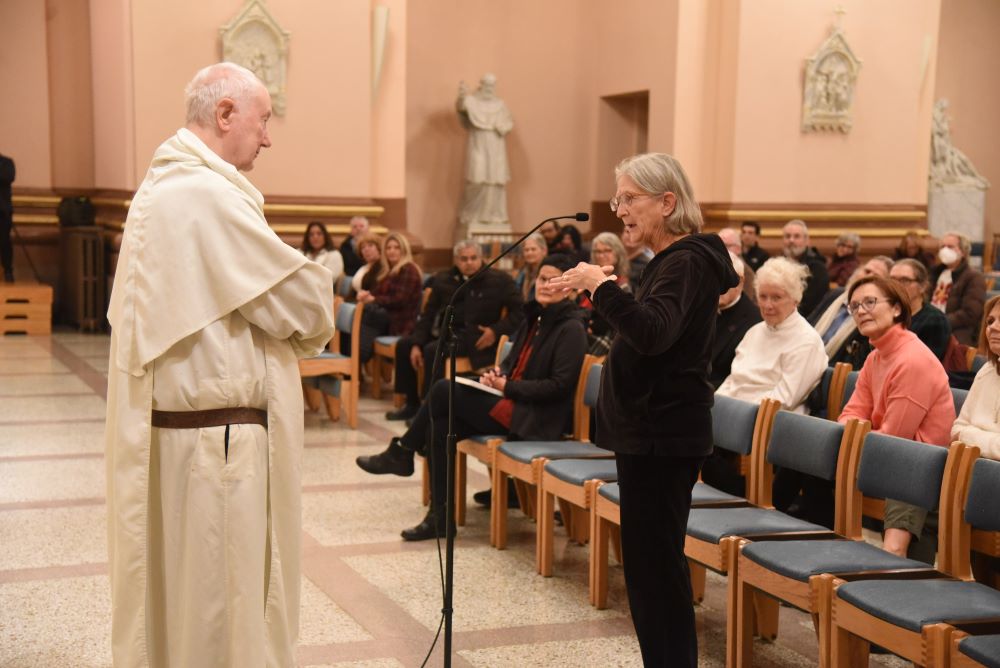 Lucy Robie, a member of St. Thomas the Apostle Parish in Fortville, Indiana, asks a question of Dominican Fr. Timothy Radcliffe at Sts. Peter and Paul Cathedral in Indianapolis Dec. 6, 2023, after the priest gave a presentation on the synod on synodality as part of a tour of U.S. cities. 