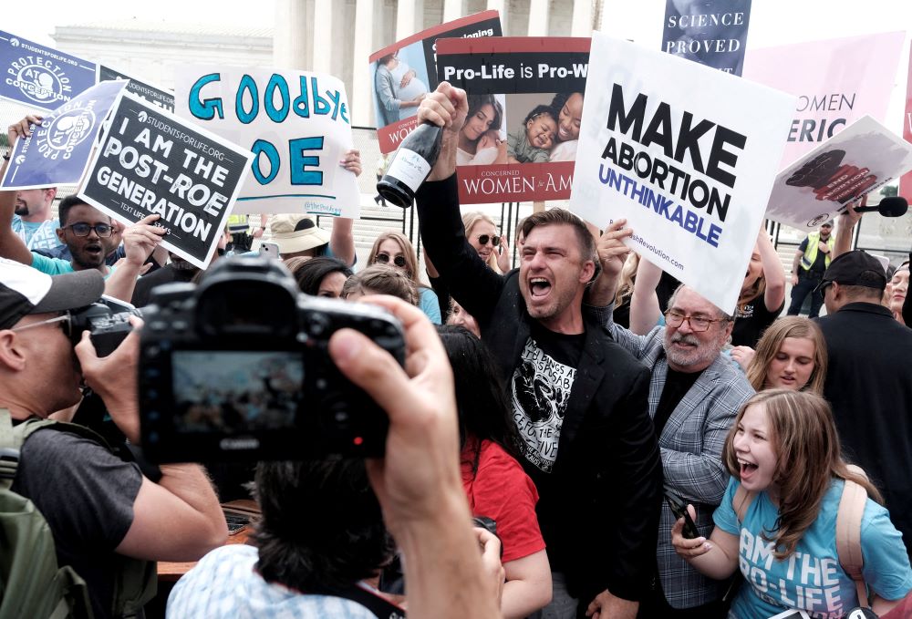 Pro-life demonstrators celebrate outside the U.S. Supreme Court in Washington June 24, 2022, as the court ruled in the Dobbs case, overturning the landmark Roe v. Wade decision.