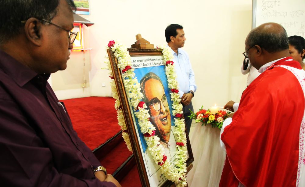 Dhaka Credit leaders and guests pay homage to the credit union's founder, Fr. Charles Joseph Young.