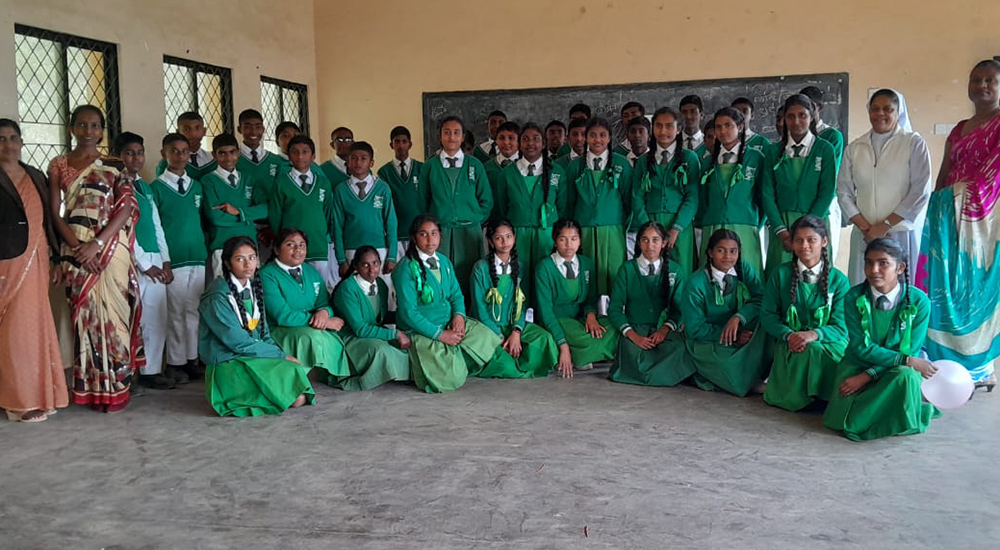 After the awareness session, Sr. Rupika Perera and her teacher counselors pose with students at a rural school. (Courtesy of Sr. Rupika Perera)