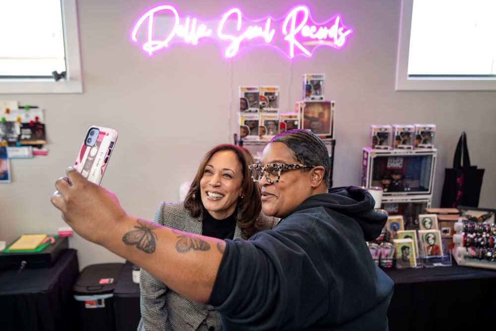 Vice President Kamala Harris poses for a photo with Della Marie Levi, owner of Della Soul Records, the first Black woman-owned vinyl record store in Grand Rapids, Michigan, Feb. 22. 