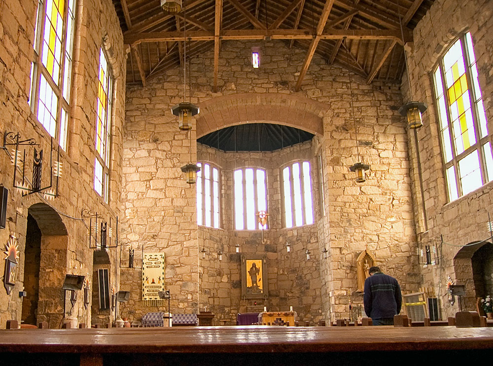 The "Apache Christ" icon is seen in the sanctuary of the church in a 2005 photo of the interior of the St. Joseph Apache Mission. (Wikimedia Commons/Dusty Matthews)