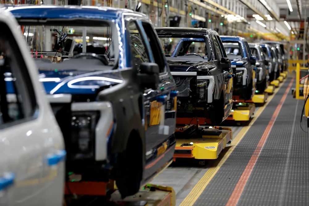 Ford Motor Company’s electric F-150 Lightnings sit on the production line at the company’s Rouge Electric Vehicle Center in Dearborn, Michigan in 2022. (Grist/AFP/Getty Images/Jeff Kowalsky)