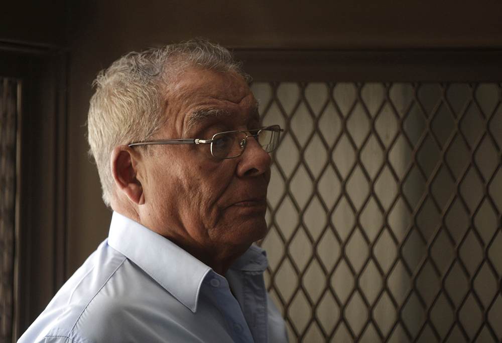 Retired Guatemalan general Benedicto Lucas García stands in a cage during a hearing at the Supreme Court of Justice Jan. 8, 2016, in Guatemala City. Lucas has gone on trial April 8 for genocide, offering an opportunity for justice for aging victims of targeted attacks on Indigenous villages during the country’s armed conflict. (OSV News/Reuters/Josue Decavele)