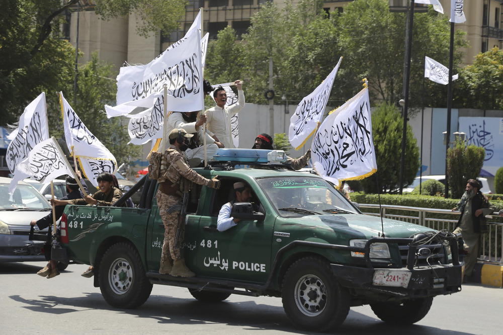 The Taliban enact moral laws that prohibit women from speaking and wearing makeup in public