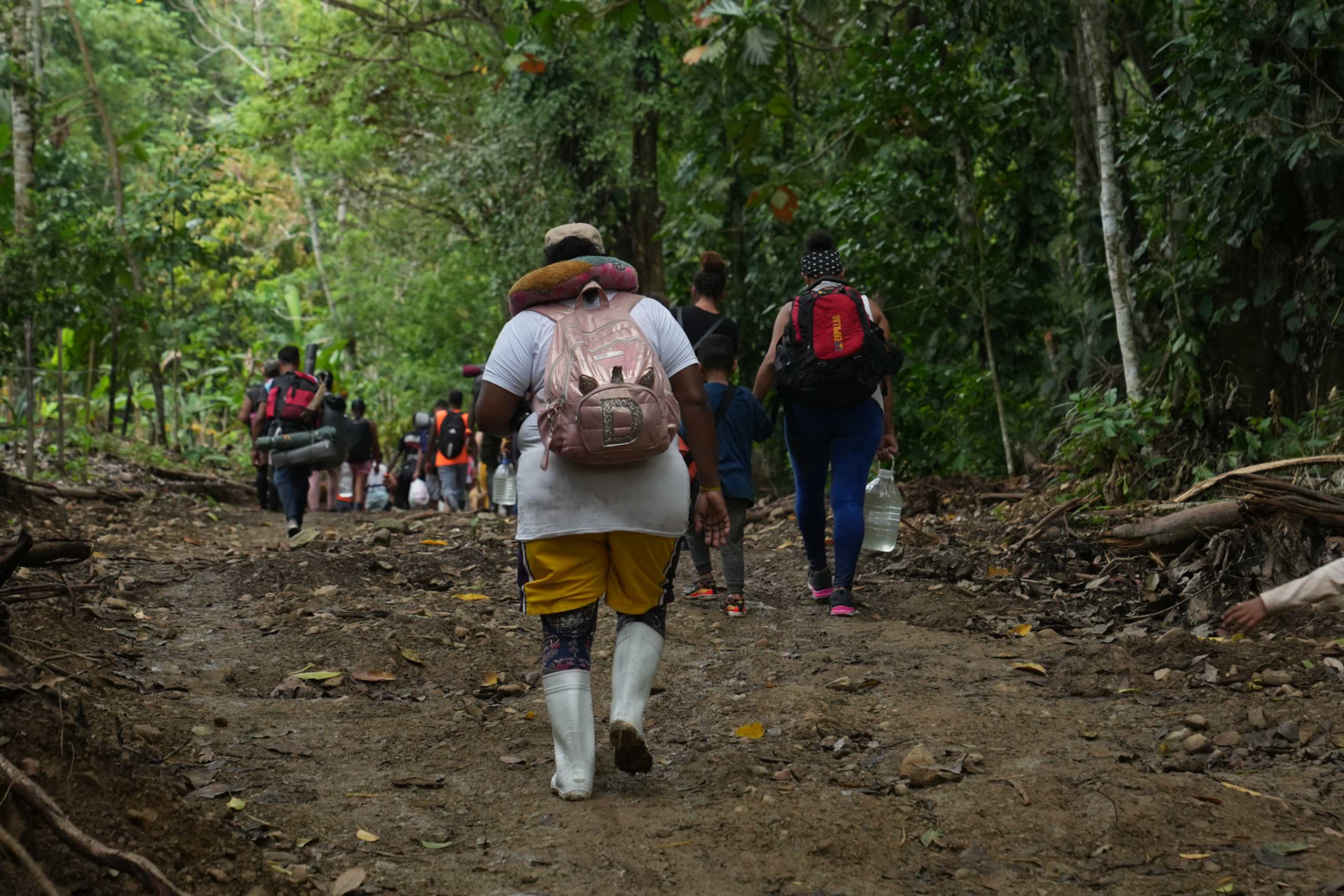 Migrants form small groups to protect themselves as they journey through the wild roads of the Darién Gap, with some acting as lookouts while others protect the most vulnerable people. 