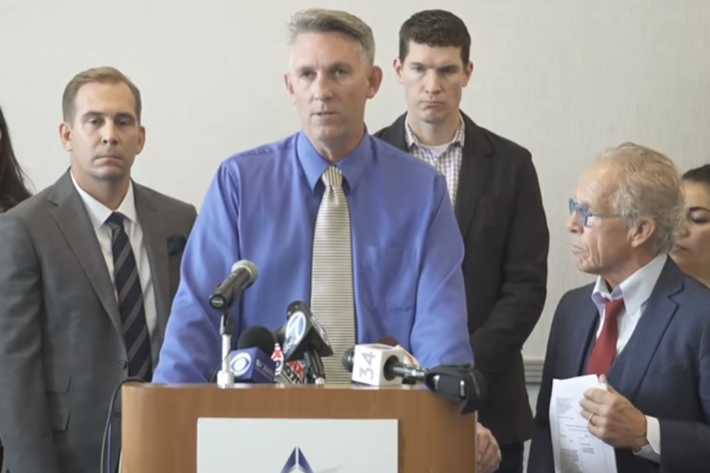 Tom Emens, survivor of sexual abuse, speaks alongside attorneys Mike Reck, left, and Jeff Anderson, during a press conference April 29, 2019, in Burbank, California. (Screenshot from livestream)