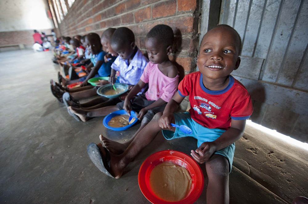 Children are pictured in a file photo eating food provided by Mary's Meals at a center in Malawi. Pope Francis addressed the U.N. Food and Agriculture Organization Oct. 16, 2020, World Food Day. (CNS/Courtesy of Chris Watt)