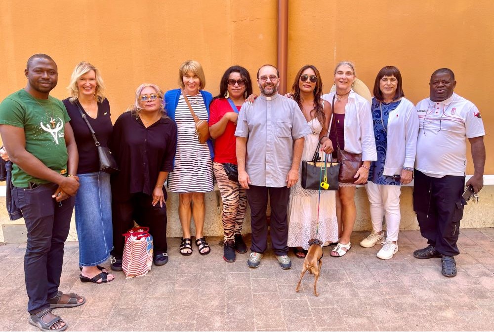 Christine Zuba, Maureen Rasmussen, Lynn Discenza and Martha Marvel meet Sept. 16 with some of the transgender sex workers Fr. Andrea Conocchia ministers to at the Church of the Immaculate Blessed Virgin in Torvaianica.