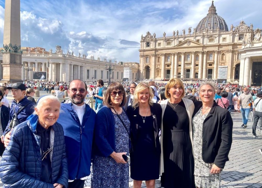 Martha Marvel, Christine Zuba, Maureen Rasmussen and Lynn Discenza pose in St. Peter's Square at the Vatican with Fr. Andrea Conocchia and Sr. Geneviève Jeanningros, on Sept. 18. 