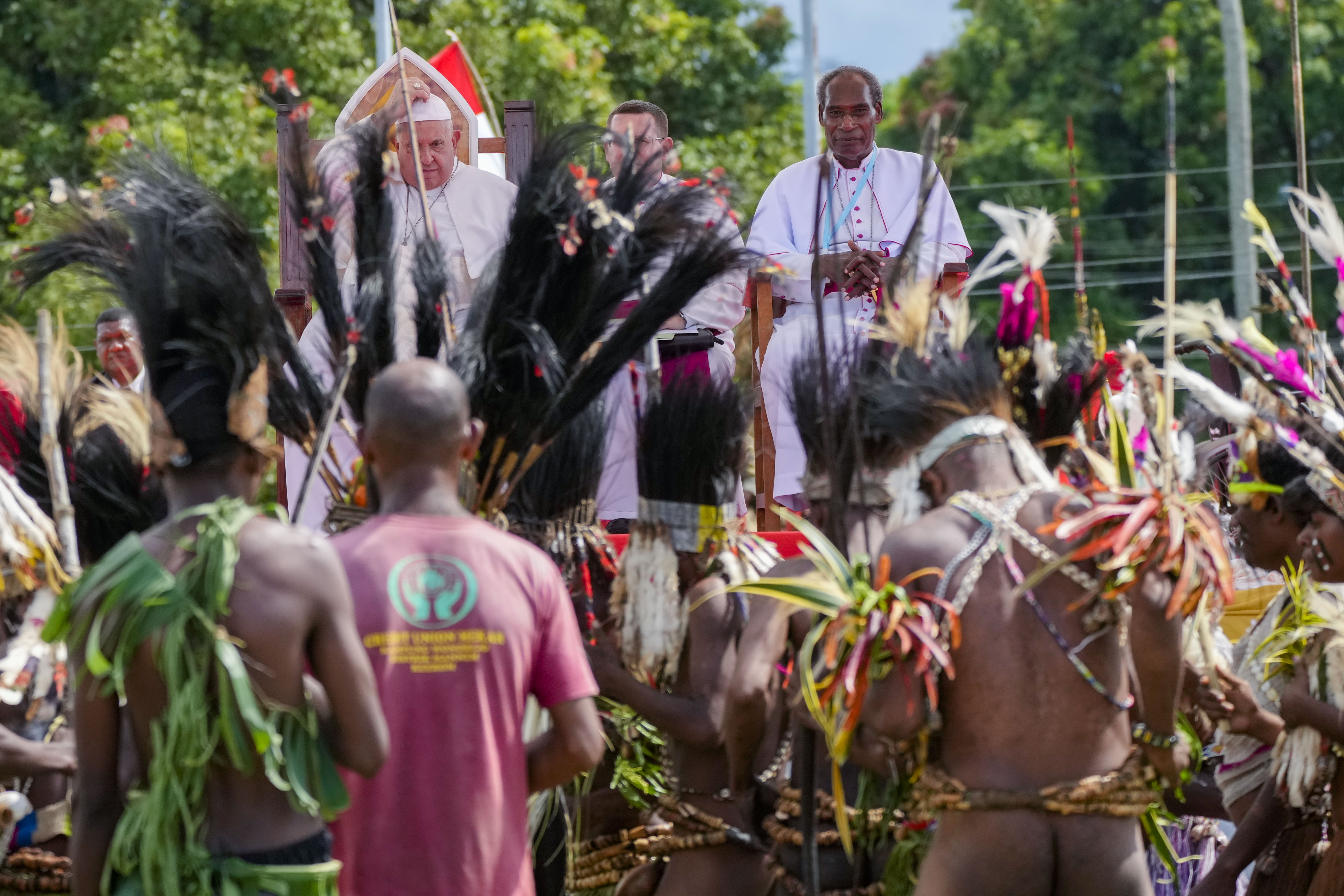 Pope Francis, with the Bishop of Vanimo Francis Meli, right, attends a meeting with faithful in Vanimo, Papua New Guinea, Sunday, Sept. 8, 2024. Pope Francis celebrated the Catholic Church of the peripheries on Sunday as he traveled to the remote jungles of Papua New Guinea, bringing with him a ton of medicine and toys and a message of love overcoming violence for the people who live there.(AP Photo/Gregorio Borgia)