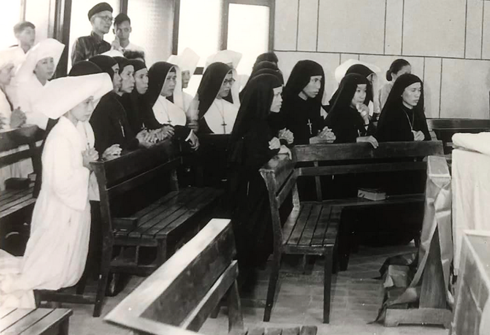 St. Paul de Chartres sisters are pictured praying in their convent in June 1954, in what is today Vietnam's Thanh Hoa Diocese, before they migrated to the south. (Courtesy of Sisters of St. Paul de Chartes)