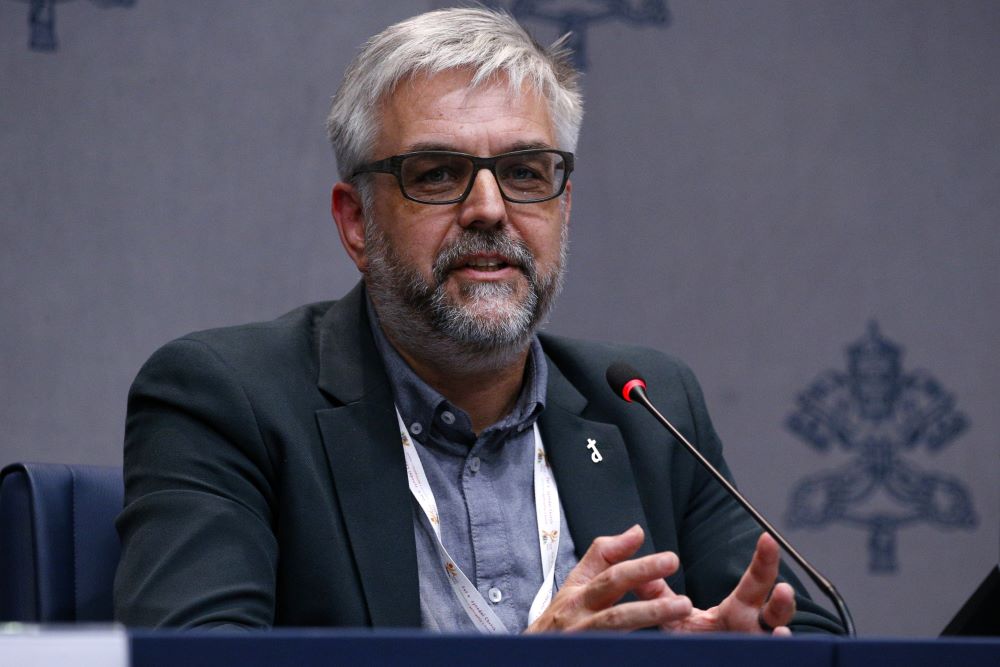 Belgian Deacon Geert De Cubber, a member of the Synod of Bishops on synodality, speaks during a news conference at the Vatican Oct. 9. 