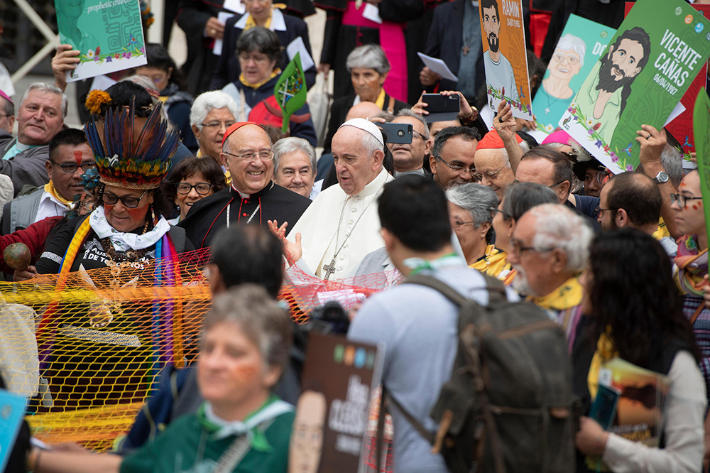 Pope Francis is pictured with Cardinal Pedro Barreto Jimeno of Huancayo, Peru, during a procession at the start of the first session of the Synod of Bishops for the Amazon at the Vatican Oct. 7, 2019. (CNS/Vatican Media)