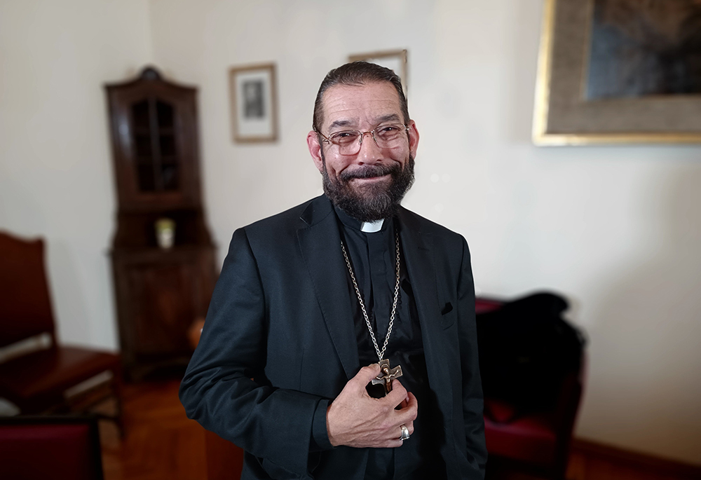 Bishop Daniel Flores of Brownsville, Texas, poses for a photo in the offices of the General Secretariat of the Synod at the Vatican, on April 12, 2023. (CNS/Robert Duncan)