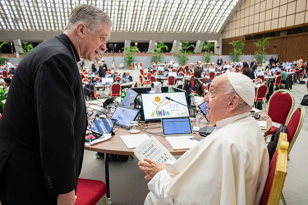 Chicago Cardinal Blase Cupich speaks with Pope Francis during a break of the synod on synodality in the Paul VI Audience Hall at the Vatican Oct. 22, 2024. (CNS/Vatican Media)