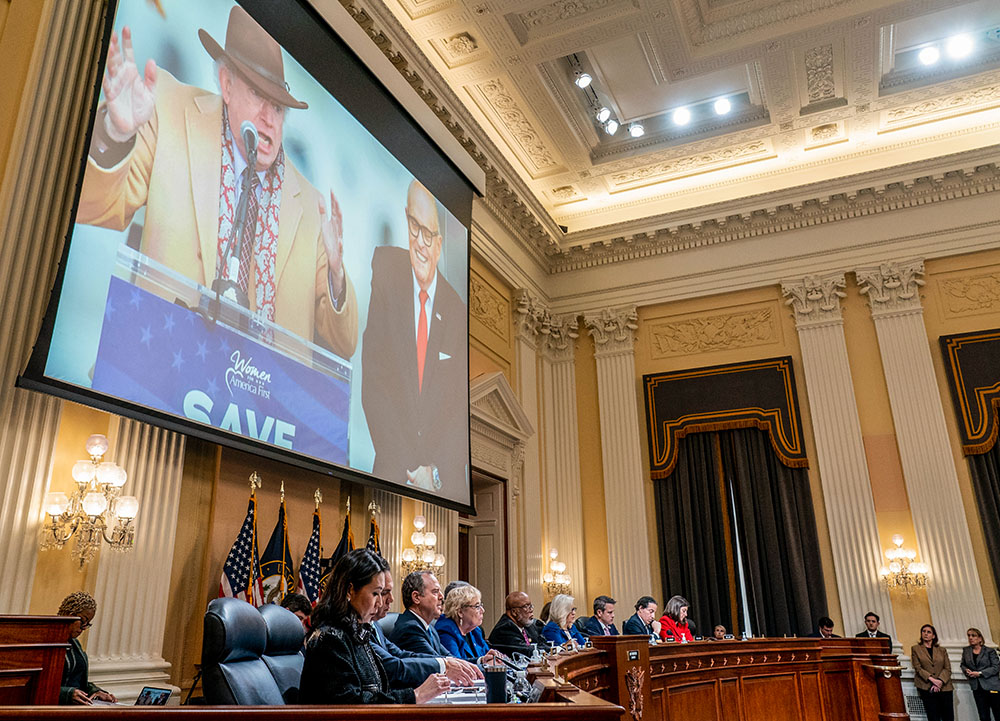 An image of John Eastman, left, and former New York Mayor Rudolph Giuliani is displayed on a screen as the House select committee investigating the Jan. 6 attack on the U.S. Capitol holds a hearing on Capitol Hill in Washington Oct. 13, 2022. (AP/Andrew Harnik, Pool)