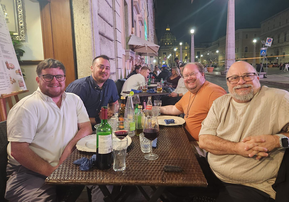 From left to right: George White, Maxwell Kuzma, Br. Christian Matson and Scotty Pignatella are pictured in Rome, Oct. 22, the night before meeting Pope Francis. (Courtesy of George White)