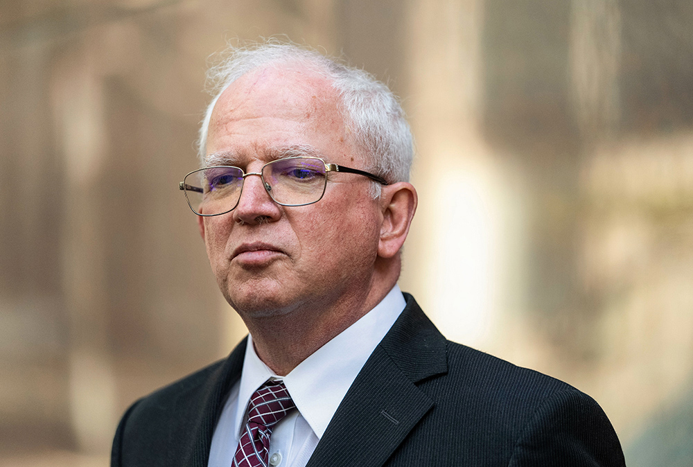 Attorney John Eastman, an architect of a legal strategy aimed at keeping former President Donald Trump in power, listens to questions from reporters after a hearing in Los Angeles June 20, 2023. (AP/Jae C. Hong)