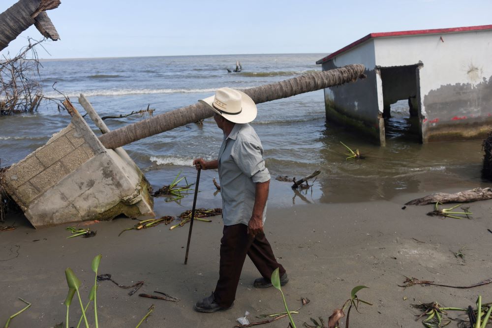 A man walks past the place where his house once stood in El Bosque, Mexico