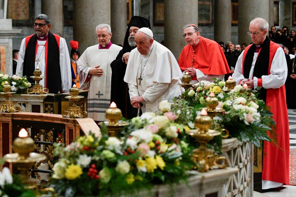 Former Anglican Archbishop Justin Welby of Canterbury, Pope Francis and other ecumenical leaders pray before the tomb of St. Paul. 