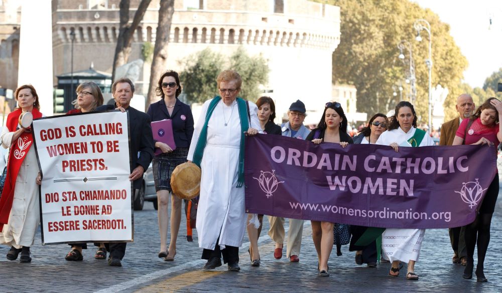 Then Maryknoll Fr. Roy Bourgeois marches toward the Vatican during a demonstration calling for women's ordination in Rome Oct. 17, 2011. 