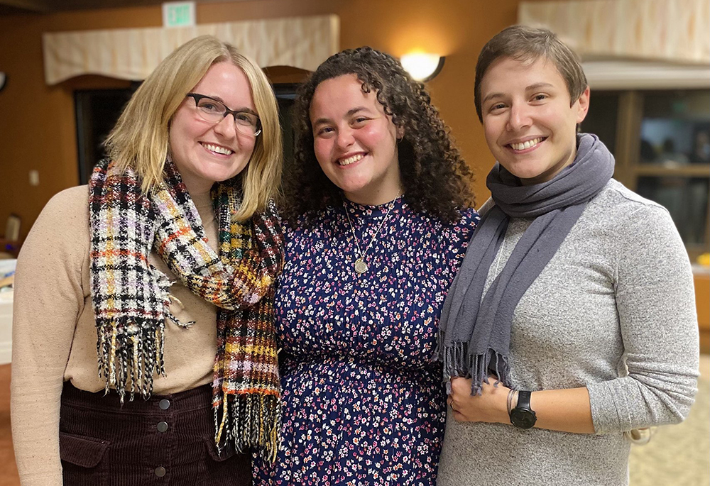 Katie Gordon, left, and Benedictine Sisters Jacqueline Sanchez-Small and Val Luckey, are pictured during now-Sister Sanchez-Small's first profession ceremony with the Benedictine community of Erie, Pennsylvania, on Nov. 13, 2021. (CNS/Courtesy of Global Sisters Report/Katie Gordon)