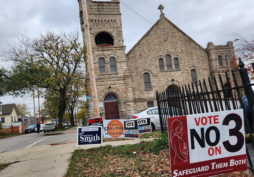 Signs opposing Missouri's Amendment 3 are posted outside Sacred Heart Guadalupe Catholic Church in Kansas City, Missouri. The proposed amendment would establish a right in the state constitution to abortion. (NCR photo/Brian Roewe)