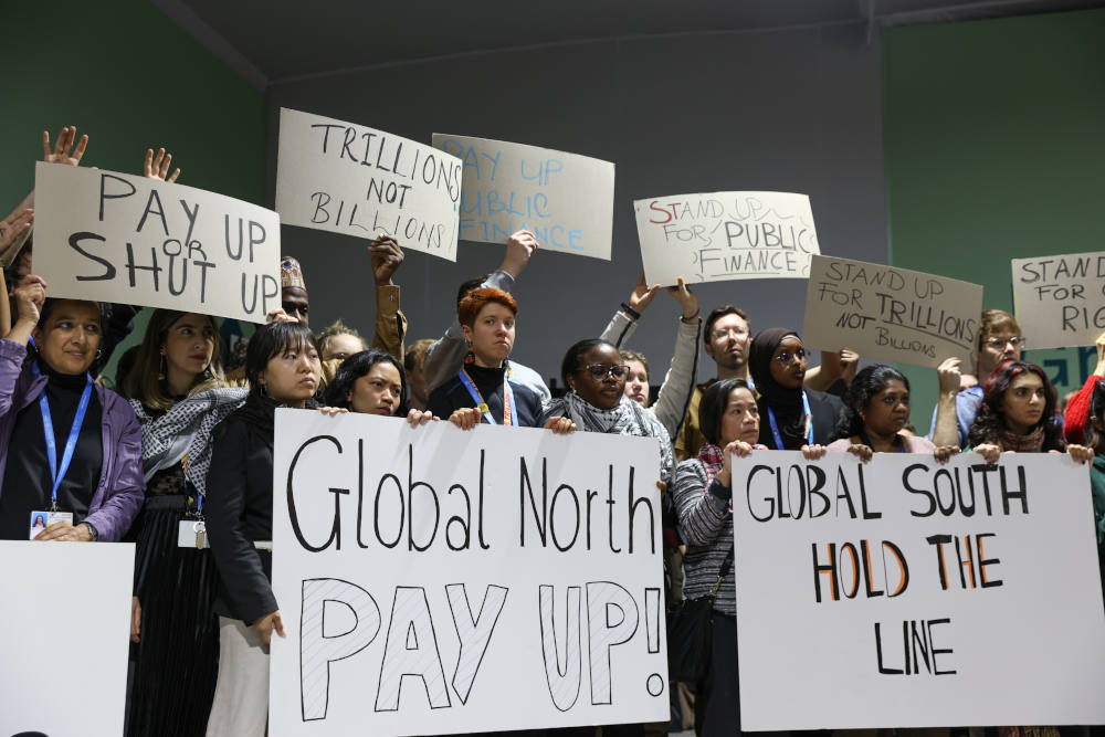 Climate activists hold a demonstration in response to a target for financing climate change responses under negotiation at the United Nations climate change conference, in Baku, Azerbaijan. The summit, called COP29, ultimately struck a deal for $300 billion by 2035 for developing countries. (UN Climate Change/Kiara Worth)