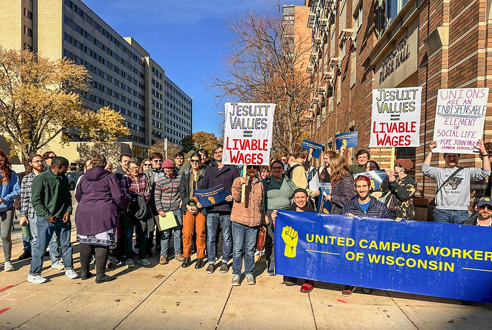 More than 50 Marquette University students, staff and faculty rally on campus Nov. 8 in Milwaukee, in support of the unionization effort of non-tenure-track employees from Marquette's Klingler College of Arts and Sciences. (Ericka Tucker)