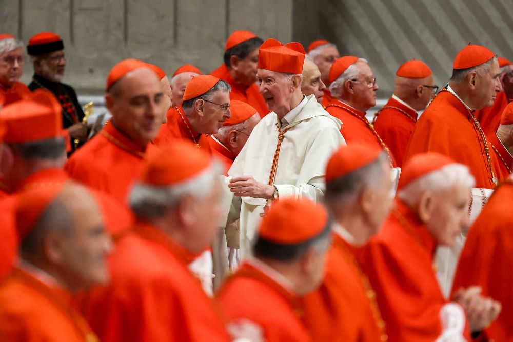 Newly created Cardinal Timothy Radcliffe, a Dominican theologian, is congratulated by other members of the College of Cardinals after receiving his red hat from Pope Francis at a consistory Dec. 7 in St. Peter's Basilica at the Vatican. (CNS/Lola Gomez)